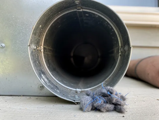 Fountain Dryer Vent Cleaning technician using specialized equipment to clear severe dryer vent blockage in Fountain